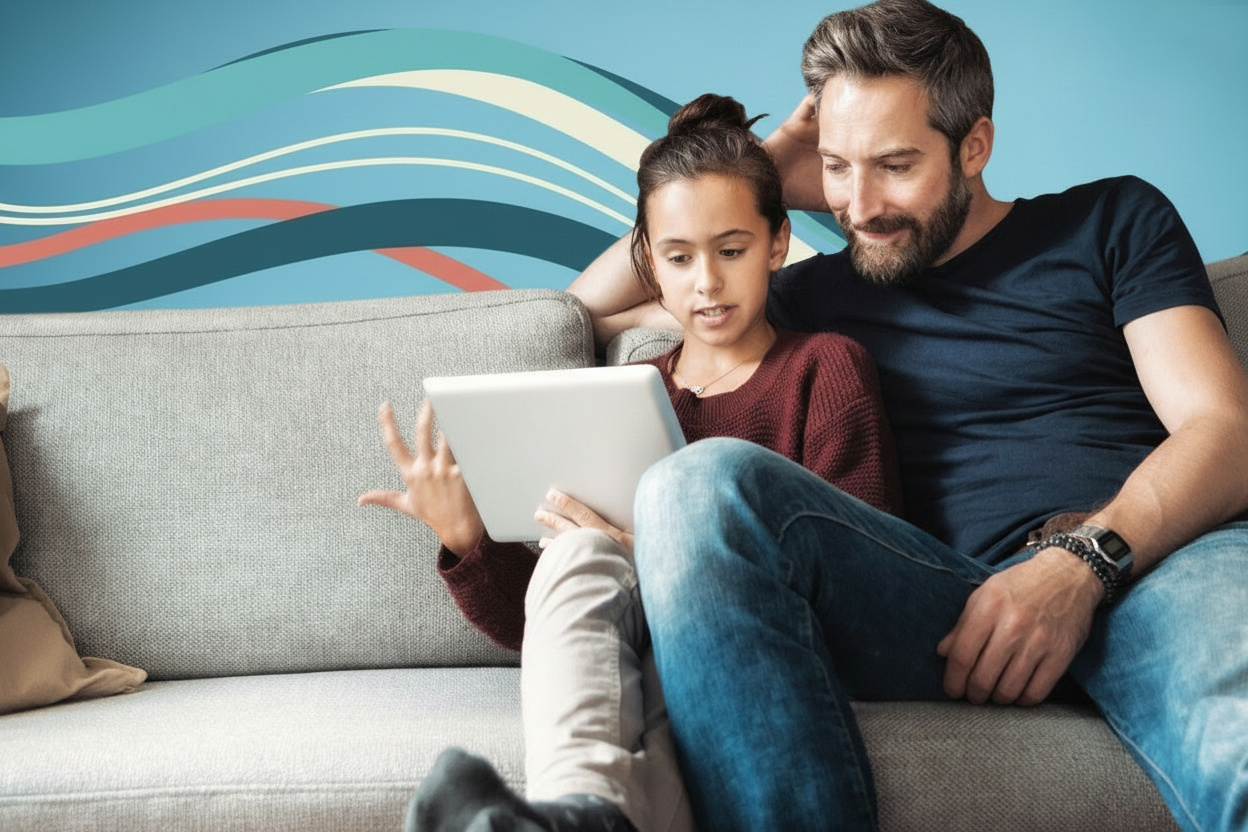 A father and daughter looking at a tablet together